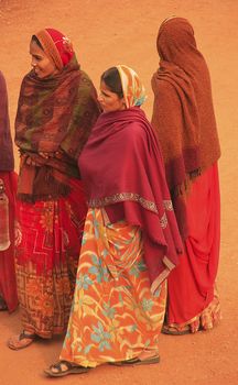 Indian women in colorful sari standing in courtyard of Safdarjung Tomb, New Delhi, India