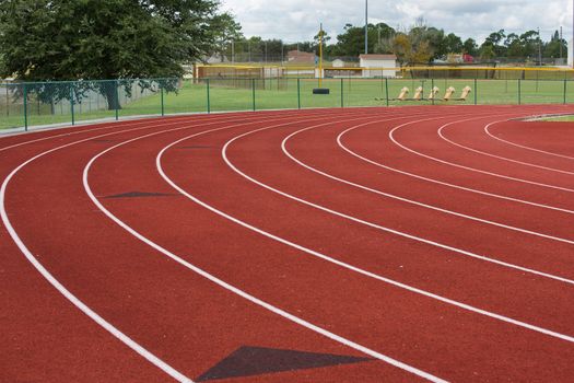 The lanes curve into the straightaway in this image of a local running track.