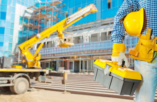 contractor with tools on construction site