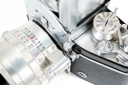 detail of retro old vintage analog photo camera on white background view from the top