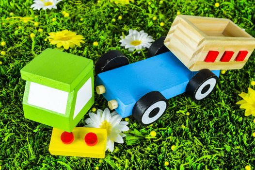 Crushed toy truck on a grass background