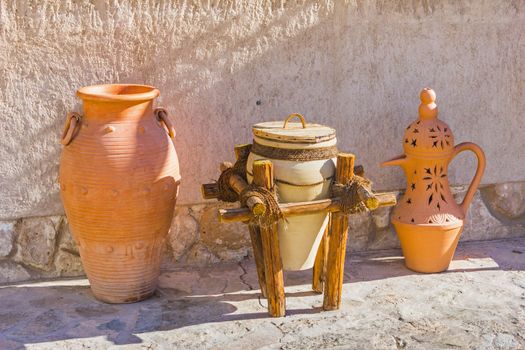 Eastern pitchers stand on a shelf in an Arab shop