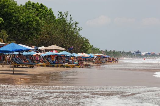 Vacationers on a beach, Bali, Indonesia, March 12, 2012. Bali � a heavenly spot in the Indian Ocean; the brightest decoration of the Indonesian archipelago