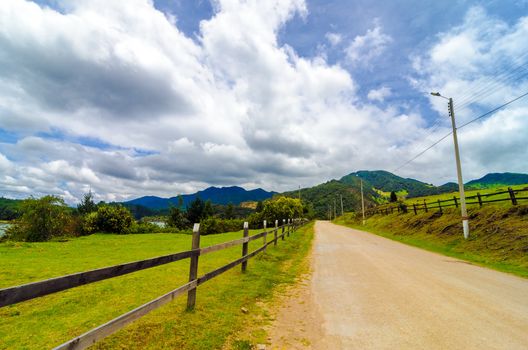 Rural country road and wooden fence in Neusa, Colombia