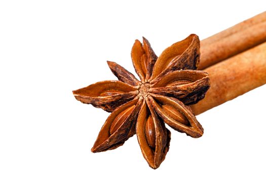 Star anise and two cinnamon sticks isolated on white background