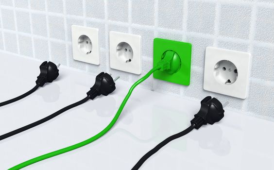 ecological green plug is connected to a green socket placed on the wall and three other traditional plugs are disconnected and lie on the ground