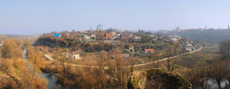 Old city panorama at early spring with church on the hill, Kamianets-Podilskyi, Ukraine