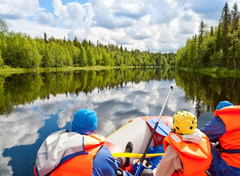 Rafters in a rafting boat on Pistojoki river in Karelia, Russia