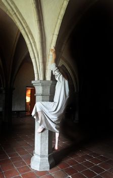 Mad woman trying to climb a pillar.