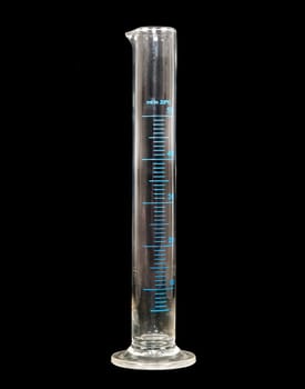 empty measuring cylinder made of glass on black background