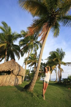 Young woman standing at Las Galeras beach, Samana peninsula, Dominican Republic