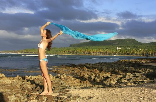 Young woman in bikini standing at Las Galeras beach, Samana peninsula, Dominican Republic