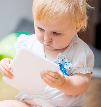 adorable baby with tablet PC