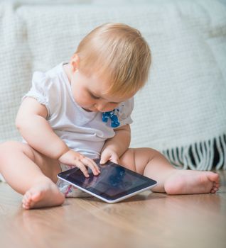 adorable baby with tablet PC