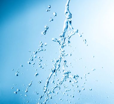 splashes of water on a blue background