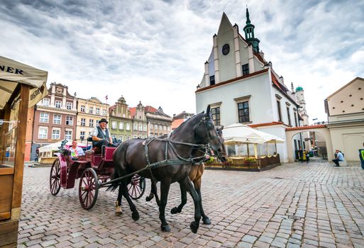 POZNAN, POLAND - AUGUST 21: The central square on August 21, 2013 in Poznan, Poland. Currently, Old Market is the center of tourism Poznan and the most beautiful part of the city.