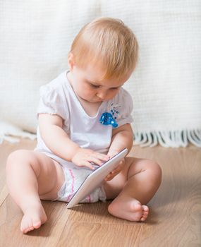 adorable baby with tablet PC