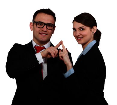 Young business couple touching their index fingers while posing against a white background.