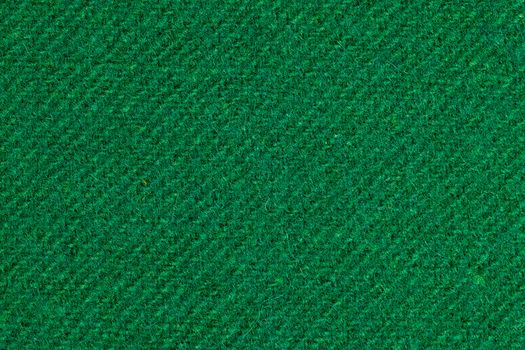 Poker table felt background in green color