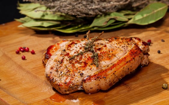 Grilled steak on wooden cutting board