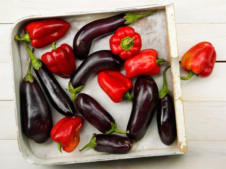 tasty ripe red peppers and eggplants in the basket