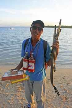 Local man selling souvenirs at Boca Chica beach, Dominican Republic