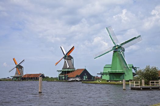 Very old authentic windmills in a row in Zaandam or Zaanse Schans, Neterhlands, Holland, Europe.
Very popular with the tourists and old are of Netherlands