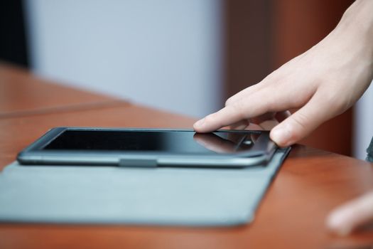Human hand using tablet computer