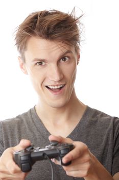 Laughing man plays computer game using joystick