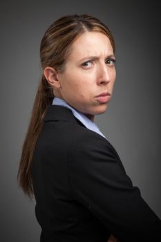 Attractive caucasion business woman in her 30s shot in studio isolated on a white background in her 30s shot in studio isolated on a grey background