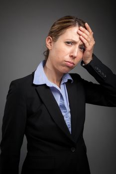 Attractive caucasion business woman in her 30s shot in studio isolated on a white background in her 30s shot in studio isolated on a grey background