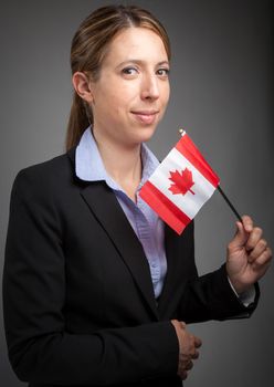 Attractive caucasion business woman in her 30s shot in studio isolated on a white background in her 30s shot in studio isolated on a grey background