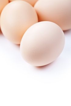 Chicken eggs on white background with copy space