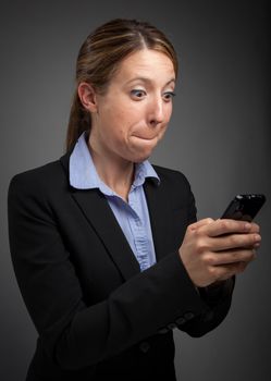 Attractive caucasion business woman in her 30s shot in studio isolated on a white background in her 30s shot in studio isolated on a grey background