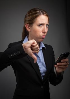 Attractive caucasion business woman in her 30s shot in studio isolated on a white background in her 30s shot in studio isolated on a grey background