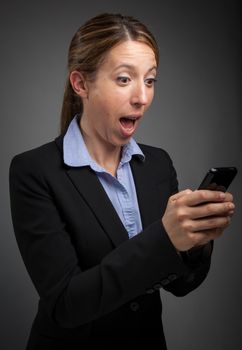 Attractive caucasion business woman in her 30s shot in studio isolated on a white background in her 30s shot in studio isolated on a grey background