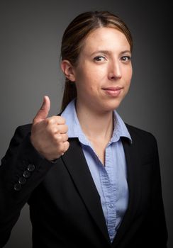 Attractive caucasion business woman in her 30s shot in studio isolated on a white background in her 30s shot in studio isolated on a grey background