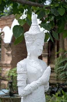 Ornate statue of a Thai buddha in the temple grounds