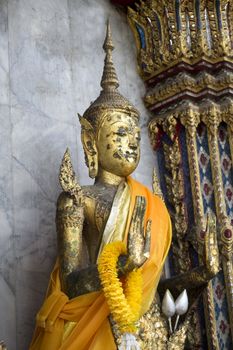 Ornate statue of a Thai buddha in the temple grounds