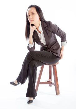 Attractive asian girl in her 30s shot in studio isolated on a white background