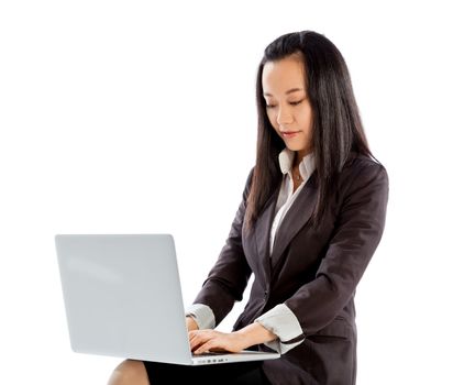 Attractive asian girl in her 30s shot in studio isolated on a white background