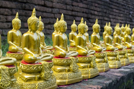 Ornate statue of a Thai buddha in the temple grounds