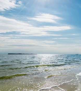 cloudy sky with sun over sea