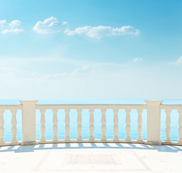 balcony near sea under cloudy sky