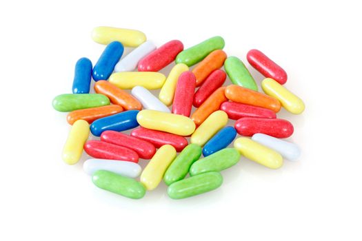 close up of colorful licorice unsorted sweets on white background