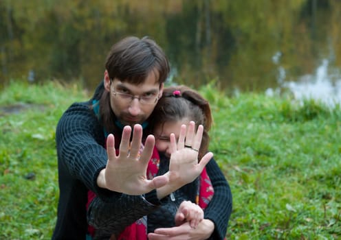 man woman closes the hand of the photographer