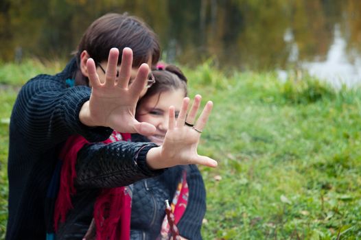 man woman closes the hand of the photographer