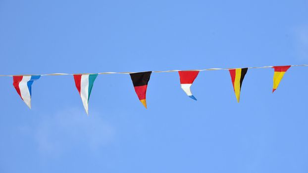 flags of various nationalities during a village festival outdoors