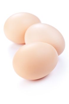 Three eggs on white background. Fresh chicken eggs