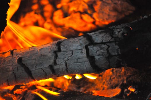 Flames, logs and a campfire